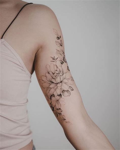 flowers tattoos on arm|flower bicep tattoo female.